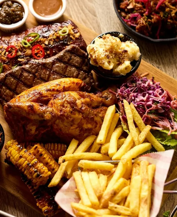 Half Roast chicken and collection of dishes