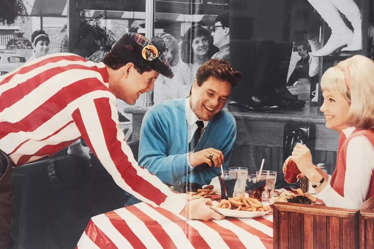 60's waiter serving food