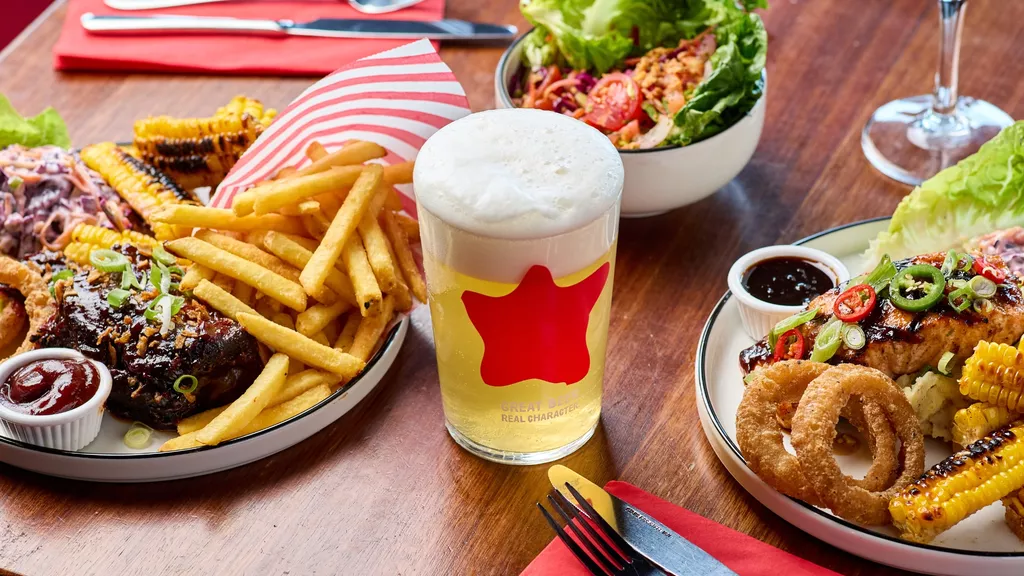 Pint on table with food