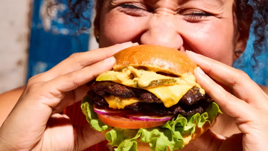 woman eating burger