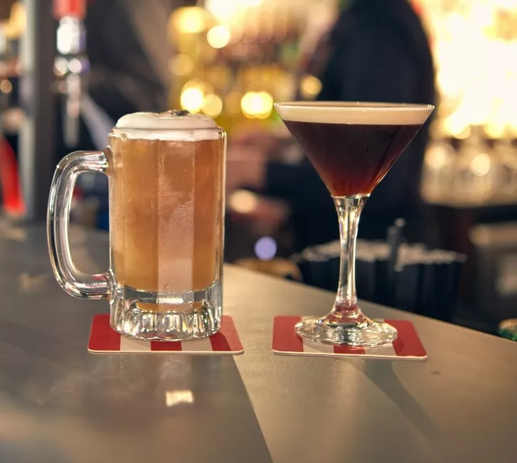 Beer and cocktail on counter